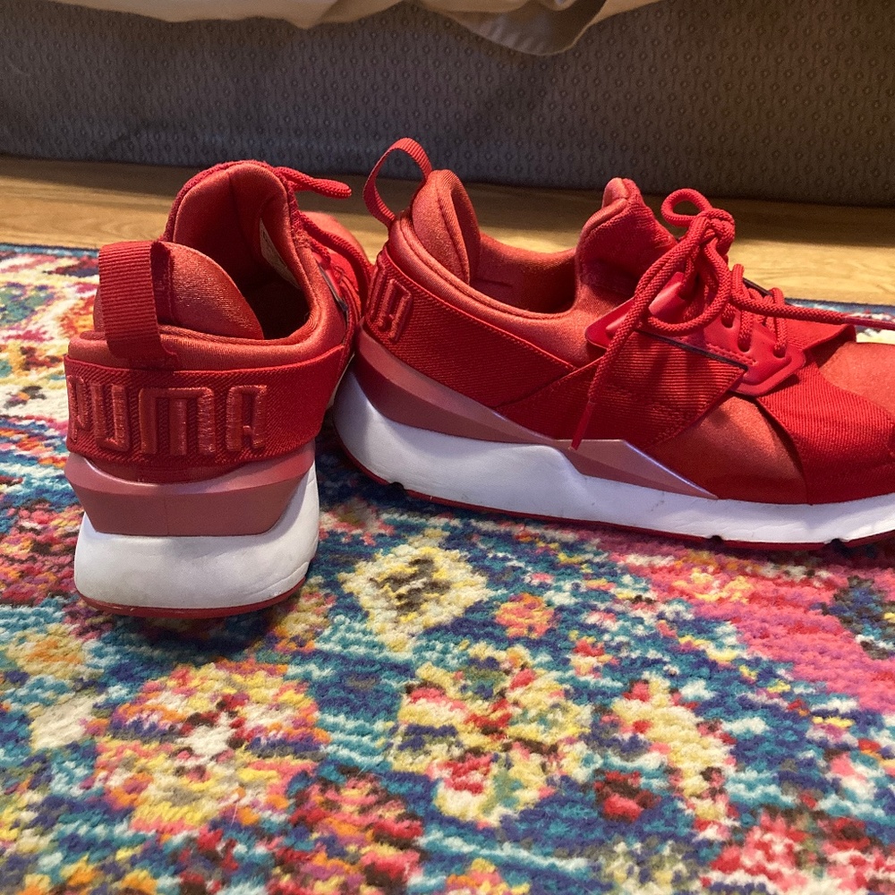 Red and white satin strappy pumas